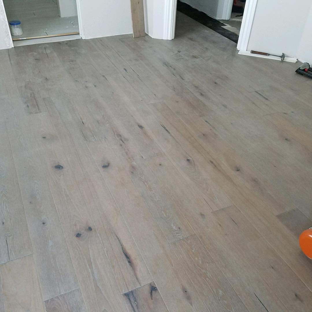 Newly installed wood-look plank flooring